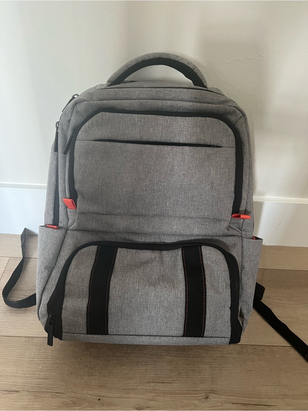 Grey Laptop Backpack with Black Trim and Orange Accents